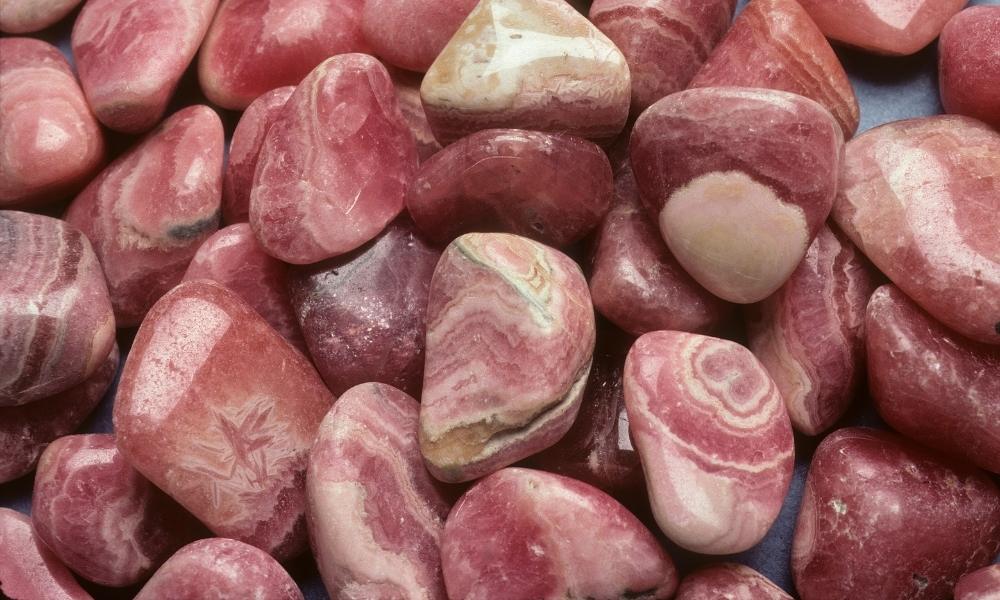 a pile of rhodochrosite class of red crystals