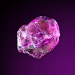 a rhodolite garnet with a black and purple background