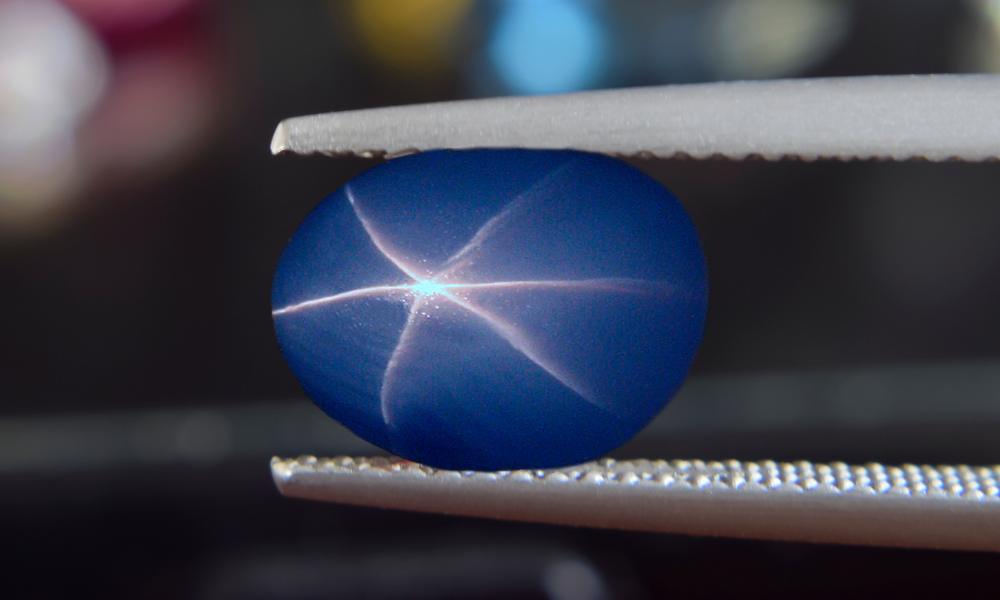 a blue sapphire with a star design on it