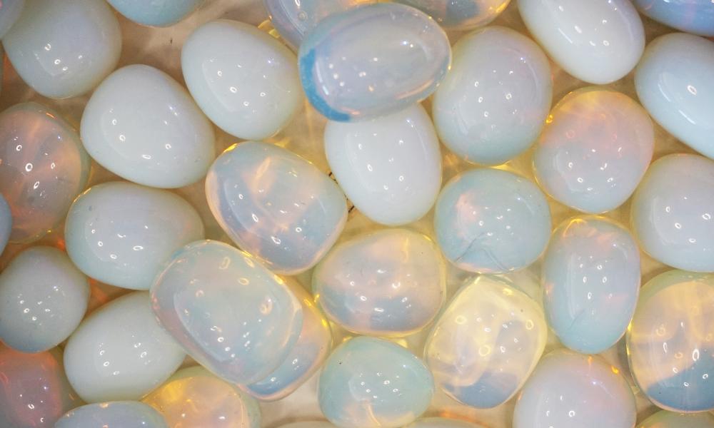 a group of white shiny opal stones