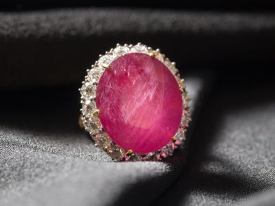 a ring with a pink sapphire stone