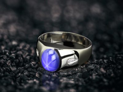 a star sapphire ring with a blue star sapphire stone in the middle