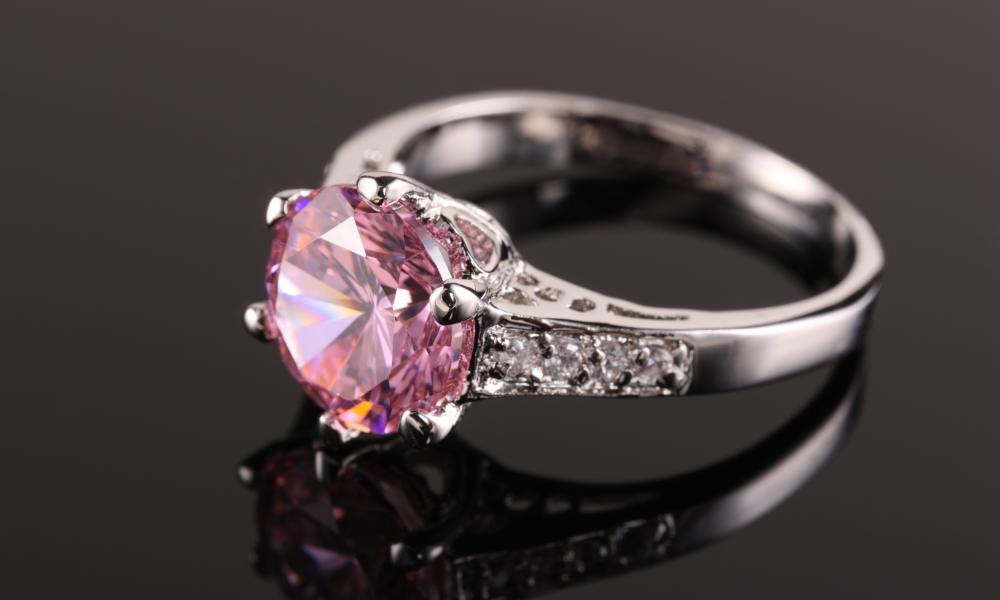 a close up of a pink sapphire ring