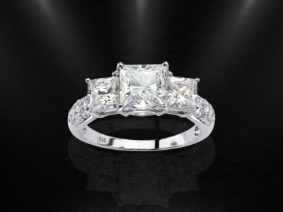 a white sapphire engagement rings with a square cut like a diamond