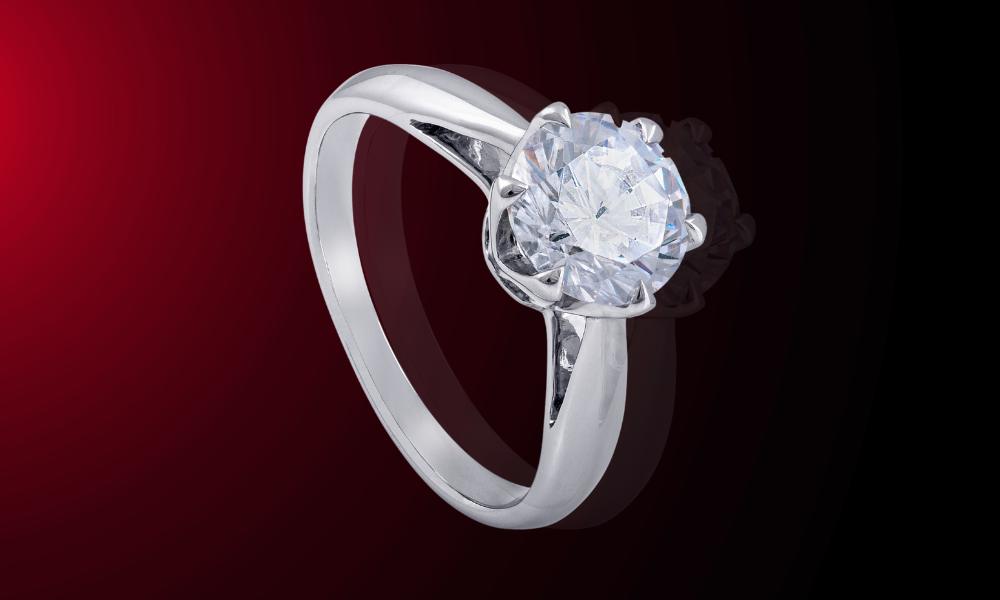 a engagement ring with a white sapphire in the center
