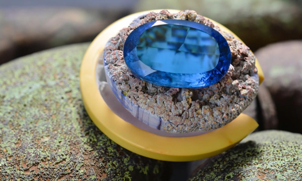 a blue montana sapphire on a rock