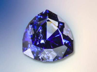 blue garnet on a blue and white gradient surface