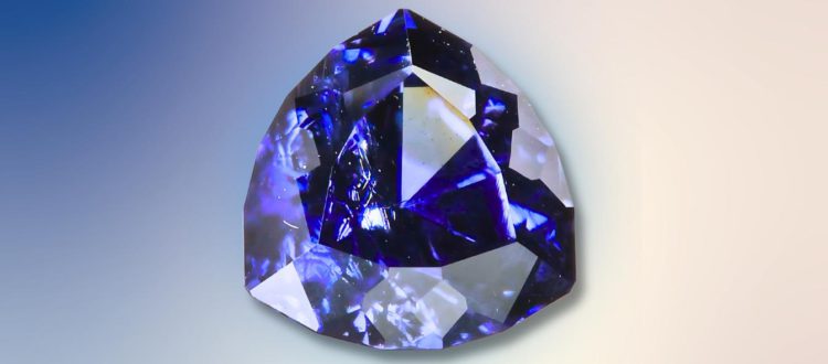 blue garnet on a blue and white gradient surface