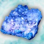 A vibrant blue amethyst and purple crystal cluster on a watercolor background.